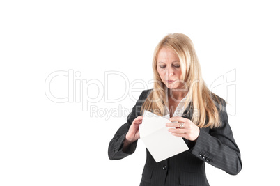 Middle aged woman opens a letter