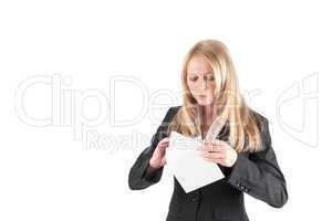 Middle aged woman opens a letter