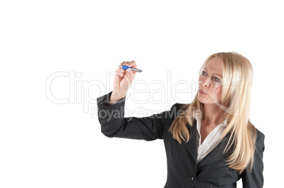 Middle aged woman writes with a pen