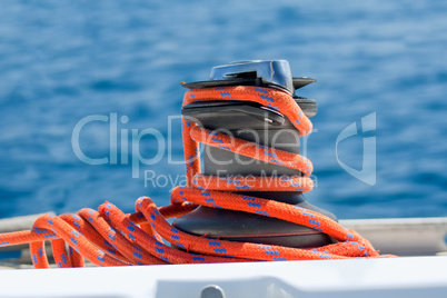 Winch with red rope on yacht