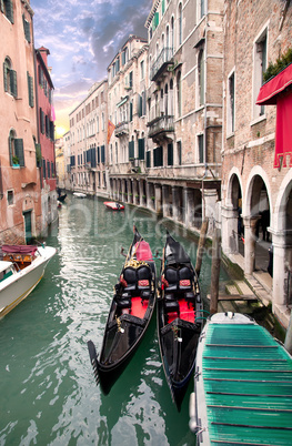 Two gondola in Venice near pier