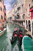 Two gondola in Venice near pier