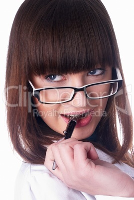 Girl biting pen