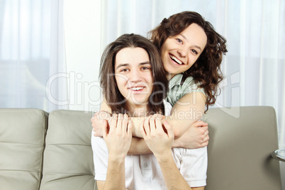 Cute woman with arm around a man