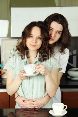 Happy couple in their kitchen