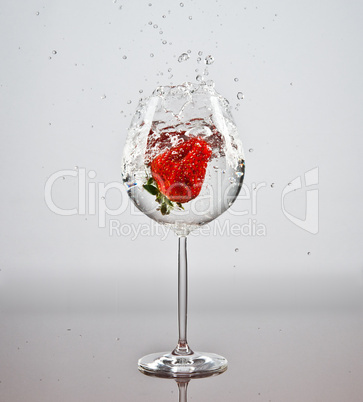 Strawberry in a glass of water