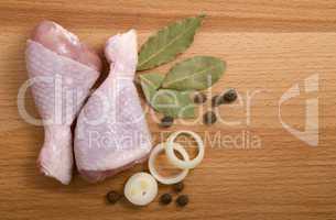 raw chicken meat with herbs, onions and peppers