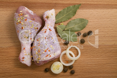 raw chicken meat with herbs, onions and peppers