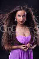 young girl with beauty long hair look at you