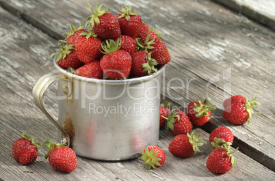garden strawberries in mug