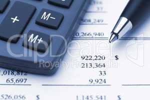 Canculator pen and financial report