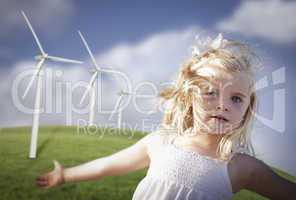 Beautiful Young Girl and Wind Turbine Field