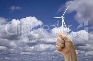 Male Fist Holding Wind Turbine Outside