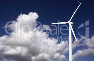 Wind Turbine Over Dramatic Sky and Clouds