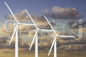 Three Wind Turbines Over Dramatic Blue Sky