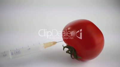 Tomatos with syringe passing