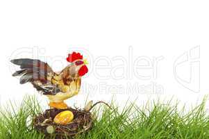 Rooster sitting on an easter nest