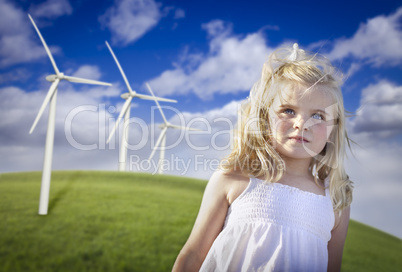 Beautiful Young Girl and Wind Turbine Field