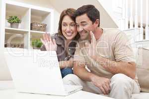Couple Making VOIP Internet Phone Call on Laptop Computer