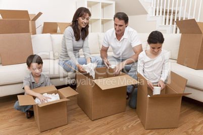 Family Unpacking Boxes Moving House