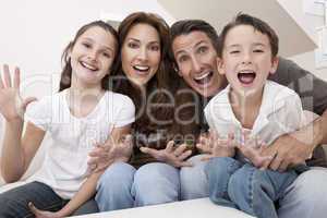 Happy Family Having Fun Sitting Laughing At Home