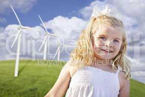 Beautiful Young Girl Playing in Wind Turbine Field
