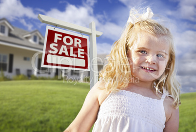 Cute Smiling Girl in Yard with For Sale Real Estate Sign and Hou