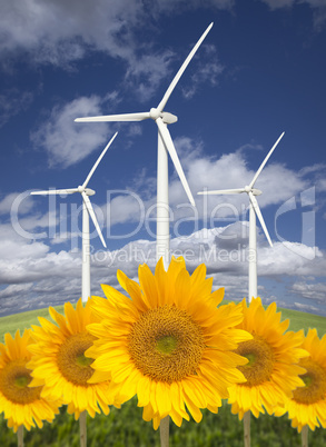 Wind Turbines Against Dramatic Sky with Bright Sunflowers