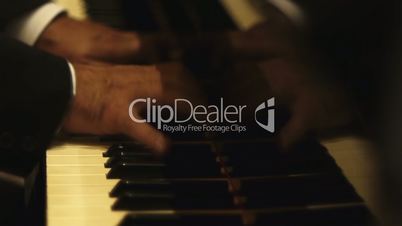 Male hands  playing piano