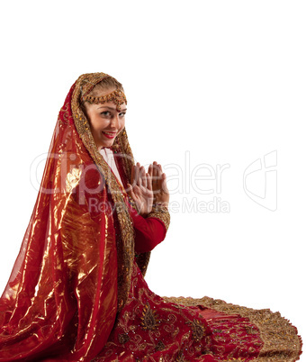 Young girl smile in oriental red indian costume