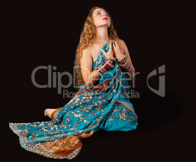 Beauty girl sit in indian costume with passion