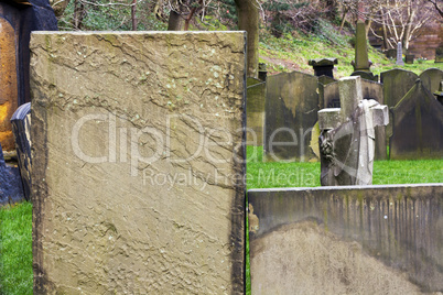 Weathered stone tombstone