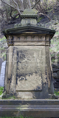 Weathered stone tombstone