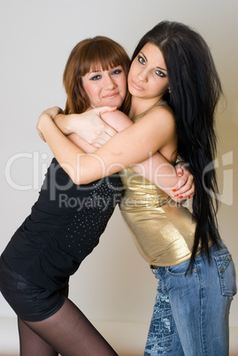 Two beautiful women posing together