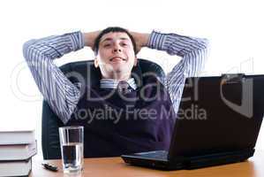 Portrait of a young businessman with laptop