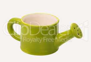 green ceramic watering can