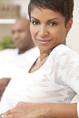 Happy African American Woman Couple Sitting At Home