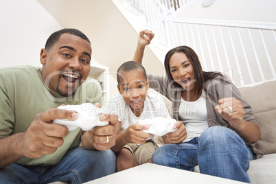 African American Family Having Fun Playing Computer Console Game