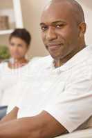 Happy African American Man Woman Couple Sitting At Home