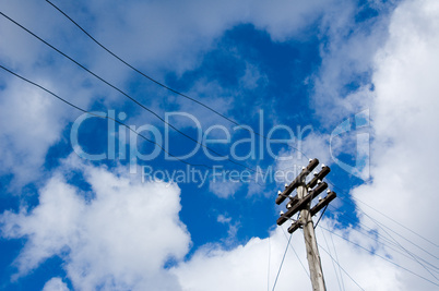 telegraph pole over blue sky background