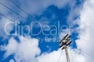 telegraph pole over blue sky background