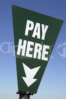 Schild: Pay here, Bezahlen Sie hier