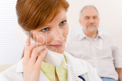 Doctor office - female physician make phone call