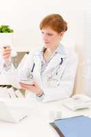 Doctor office - female physician prescription pill