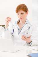 Doctor office - female physician prescription pill