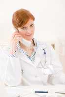 Doctor office - female physician make phone call