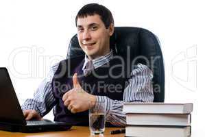 Portrait of a young businessman with laptop