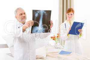 Medical team - portrait doctor x-ray in hospital