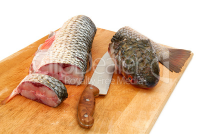 Fresh fish is split, prepared for cooking