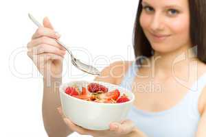 Healthy lifestyle - woman eat strawberry cereal